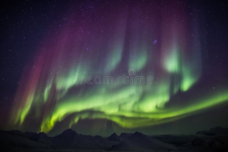 Extraordinary Aurora Borealis on the Arctic sky - Spitsbergen, Svalbard. Natural phenomenon of Northern Lights (Aurora Borealis) related to the earth's magnetic royalty free stock photography Extraordinary Aurora Borealis on the Arctic sky - Spitsbergen, Svalbard. Natural phenomenon of Northern Lights (Aurora Borealis) related to the earth's magnetic royalty free stock photography