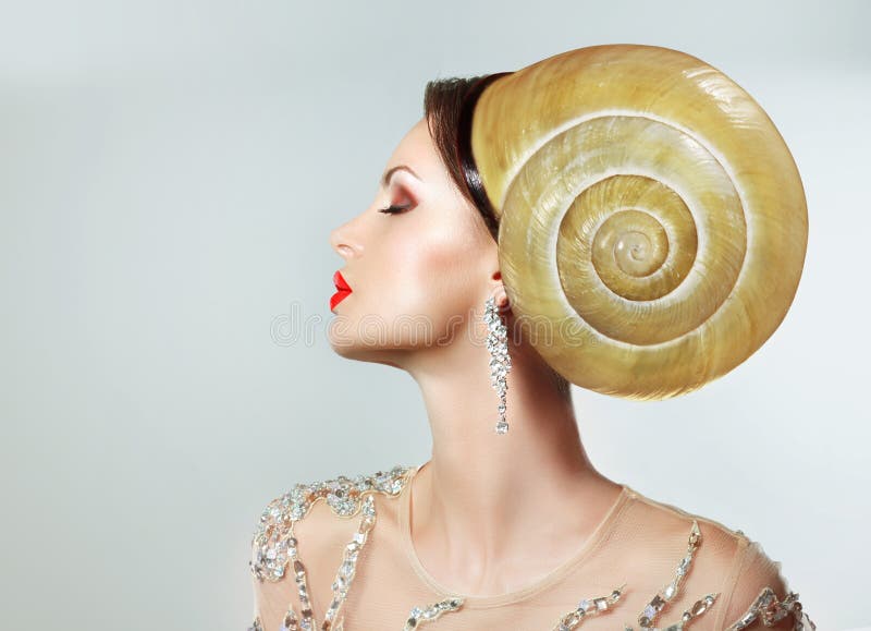 Extravagancy. Outlandish Extreme Hairstyle. Peculiar Woman with Snail as Headwear