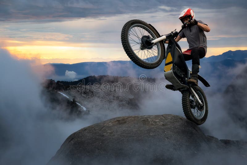 Extreme Adventure Man Motorcycle trials on top of a rock.