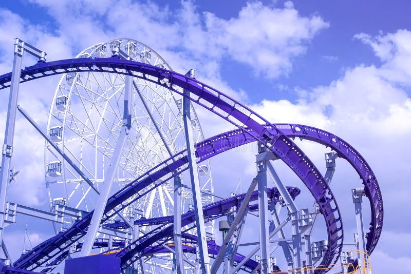 Extreme Amusement Park with Roller Coaster. Stock Image - Image of high