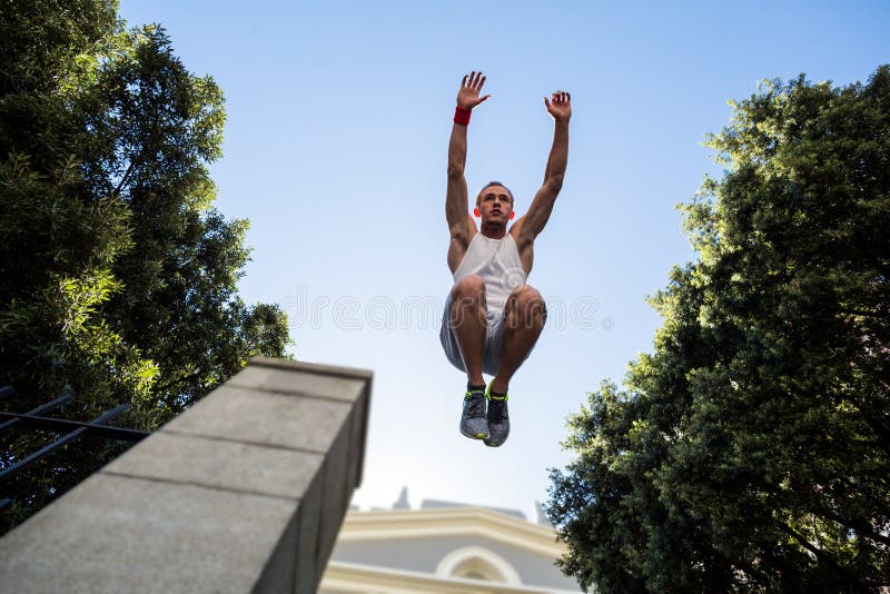 Extreme Athlete Jumping in the Air in Front of a Building Stock Image