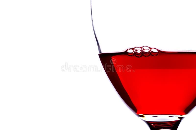 Extreme close-up of bubbles in red wine