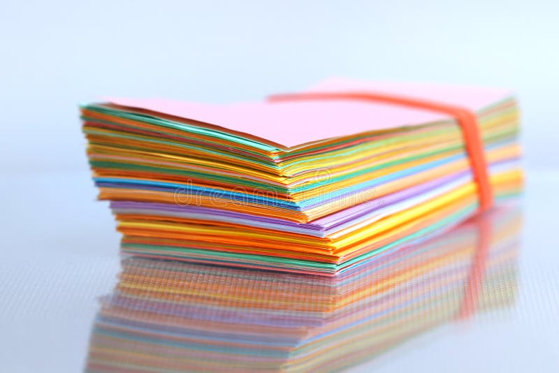 Close up shot of stack of color papers stock photo