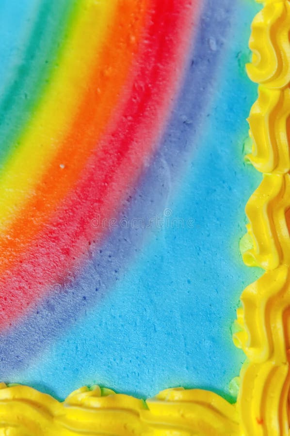 Extreme close-up van de cakehoek van de regenboogverjaardag royalty-vrije stock afbeelding Extreme close-up van de cakehoek van de regenboogverjaardag royalty-vrije stock afbeelding