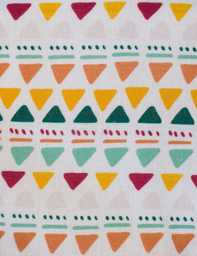 Extreme closeup of a fabric with colorful geometric design stock image