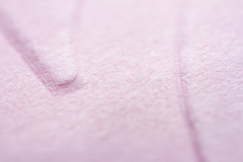 Extreme macro of embossed pink paper stock image