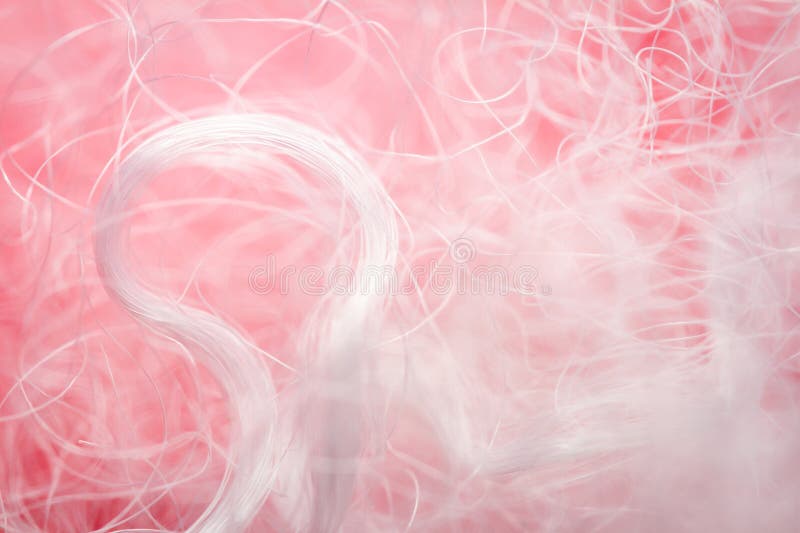 Extreme macro of polyester stable fiber on red background royalty free stock photo