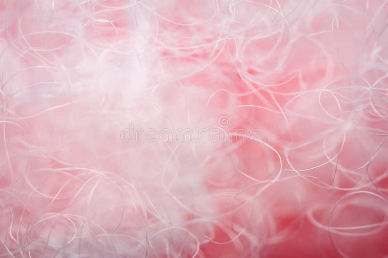Extreme macro of polyester stable fiber on red background stock photo