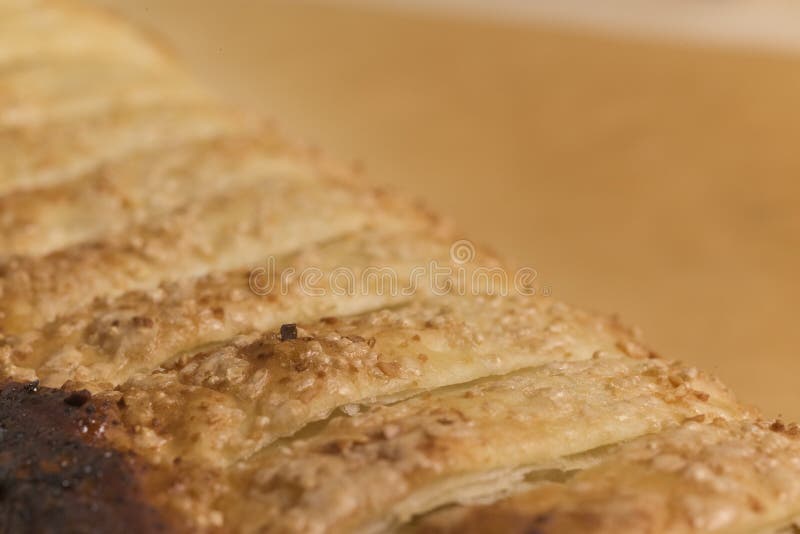 Extreme Close-Up of Apple Strudel Crust Showing Flaky Layers, Golden-Brown Edges, and Sugar Crystals in Soft Focus stock photos