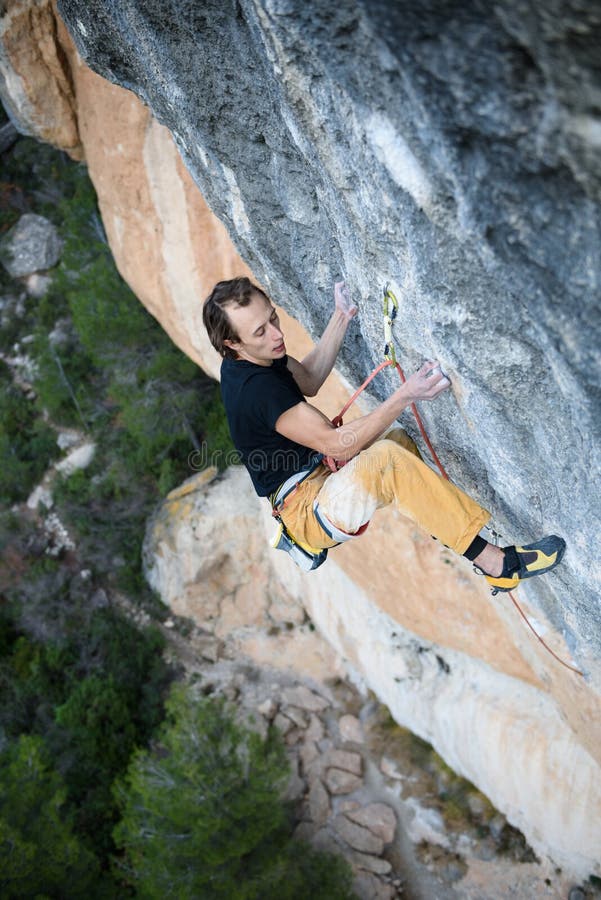 Extreme Sport Young Athletic Male Rock Climber Climbing Cliff Wall