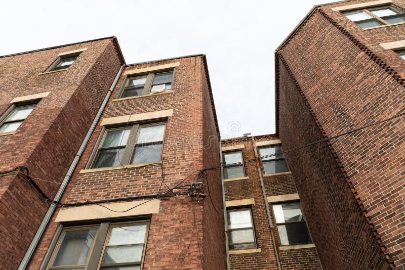 Extreme Up Angle View of Old Brick Apartment Buildings with Square and