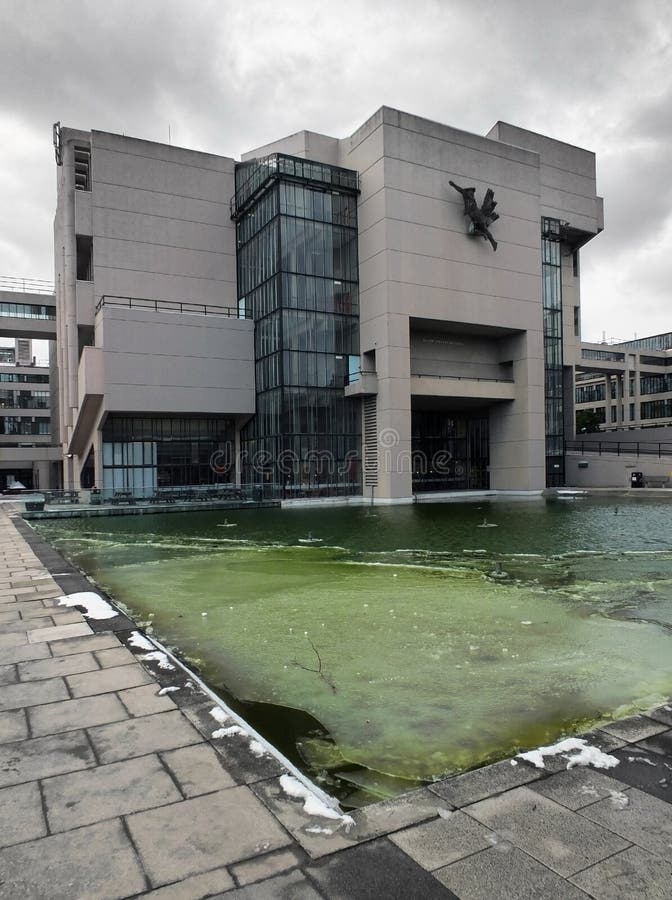 Extreme weather causing the pond to freeze in front of the 1960s brutalist roger stevens building in Leeds University