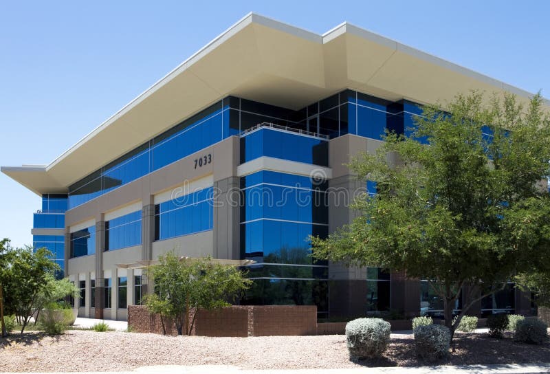 Exterior of modern corporate office building in office park. Exterior of modern corporate office building in office park.