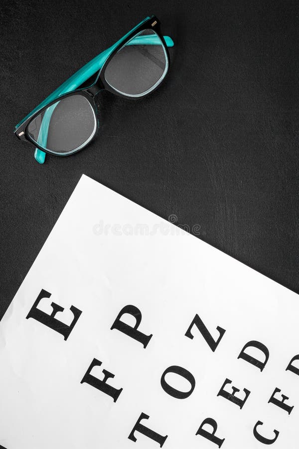 Eye Examination. Eyesight Test Chart And Glasses On Yellow Background