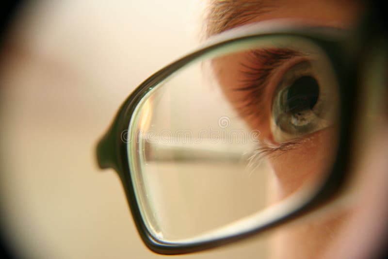 Eye with glasses closeup