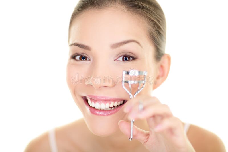 Eye makeup woman using eyelashes curler for mascara. Face care asian beauty girl royalty free stock photo Eye makeup woman using eyelashes curler for mascara. Face care asian beauty girl royalty free stock photo