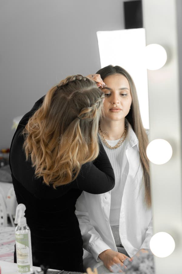 Eyebrow Correction Where the Makeup Artist Eyebrows with Attention
