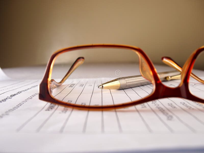 Eyeglasses, pen and paper stock photo. Image of draw 63190354