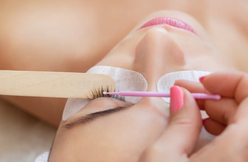 Eyelash removal procedure close up. Beautiful Woman with long lashes in a beauty salon. royalty free stock images Eyelash removal procedure close up. Beautiful Woman with long lashes in a beauty salon. royalty free stock images