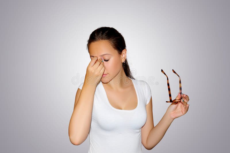 Eyes Pain. Beautiful tired unhappy woman suffering from strong eye pain. Closeup portrait of sad female. Feeling of tension, touch royalty free stock images Eyes Pain. Beautiful tired unhappy woman suffering from strong eye pain. Closeup portrait of sad female. Feeling of tension, touch royalty free stock images