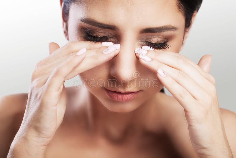 Eyes Pain Beautiful Unhappy Woman Suffering From Strong Eye Pain. Closeup Portrait Of A Sad Feminine Feeling Stress, Touching Tire royalty free stock images Eyes Pain Beautiful Unhappy Woman Suffering From Strong Eye Pain. Closeup Portrait Of A Sad Feminine Feeling Stress, Touching Tire royalty free stock images