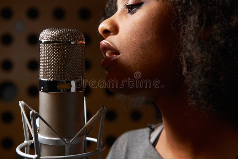 Close Up Of Female Vocalist In Recording Studio. Close Up Of Female Vocalist In Recording Studio