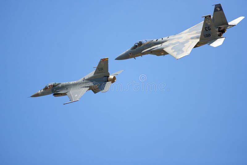 An F-15 and an F-16 do a flyby