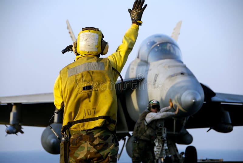 F-18 Hornet and Sailors