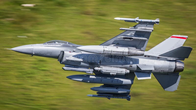 USAF F16 military fighter jet aircraft in flight at apx 600 mph. USAF F16 military fighter jet aircraft in flight at apx 600 mph.