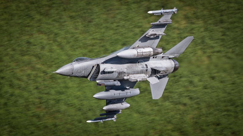 USAF F16 military fighter jet aircraft in flight at apx 600 mph. USAF F16 military fighter jet aircraft in flight at apx 600 mph.