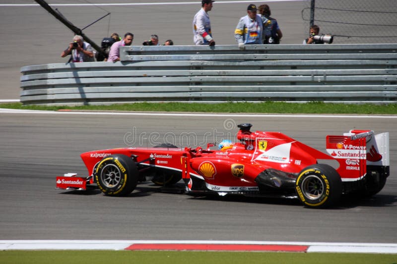 F1 Photo - Formula 1 race car Ferrari with driver Fernando Alonso in Germany on Nurburgring Grand Prix 2013. F1 Photo - Formula 1 race car Ferrari with driver Fernando Alonso in Germany on Nurburgring Grand Prix 2013