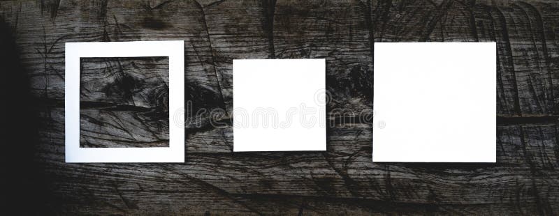 F overhead top view of white square frame on top of dark wooden scratched surface mock up concept, creative layout. Concept f retro style stock images, royalty-free photos and pictures