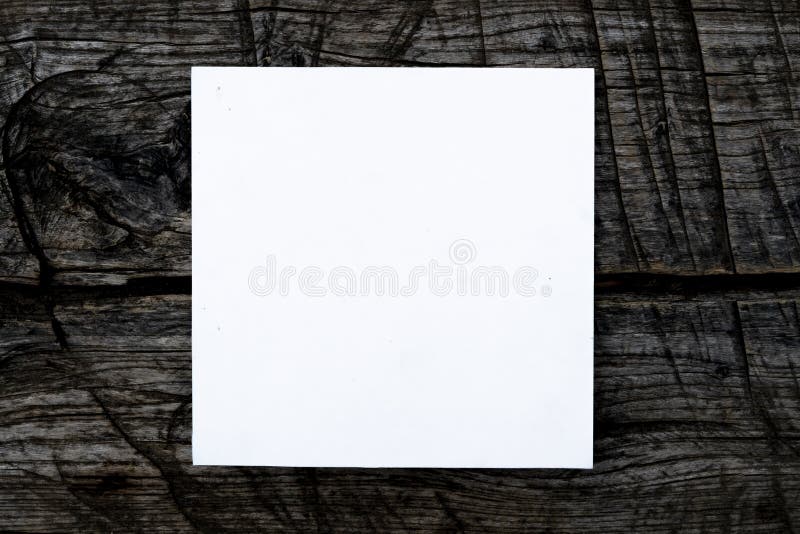 F overhead top view of white square frame on top of dark wooden scratched surface mock up concept, creative layout. Concept f retro style stock images, royalty-free photos and pictures