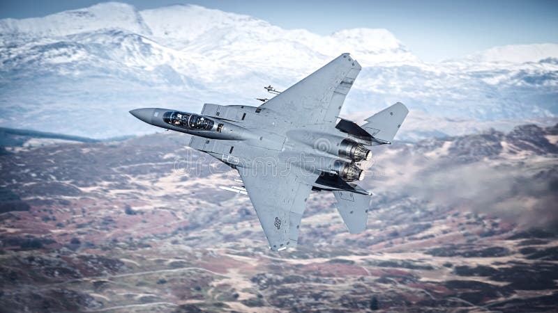 United States Air Force, USAF F15 Strike Eagle fighter jet over Snowdonia, Wales, UK.