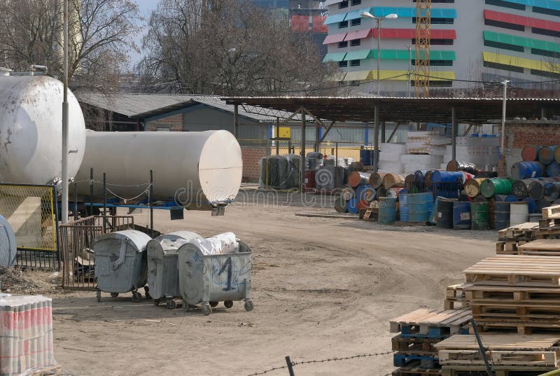 Bitumen factory courtyard with various waste. Bitumen factory courtyard with various waste