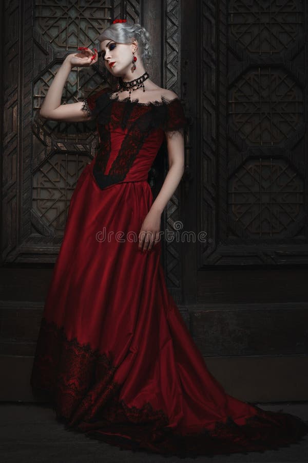 Fabelachtige vrouw in de rode kleding royalty-vrije stock afbeeldingen Fabelachtige vrouw in de rode kleding royalty-vrije stock afbeeldingen