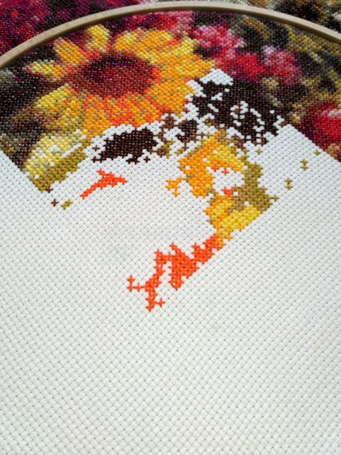Fabric with cross-stitch flowers pattern stock photos Fabric with cross-stitch flowers pattern stock photos
