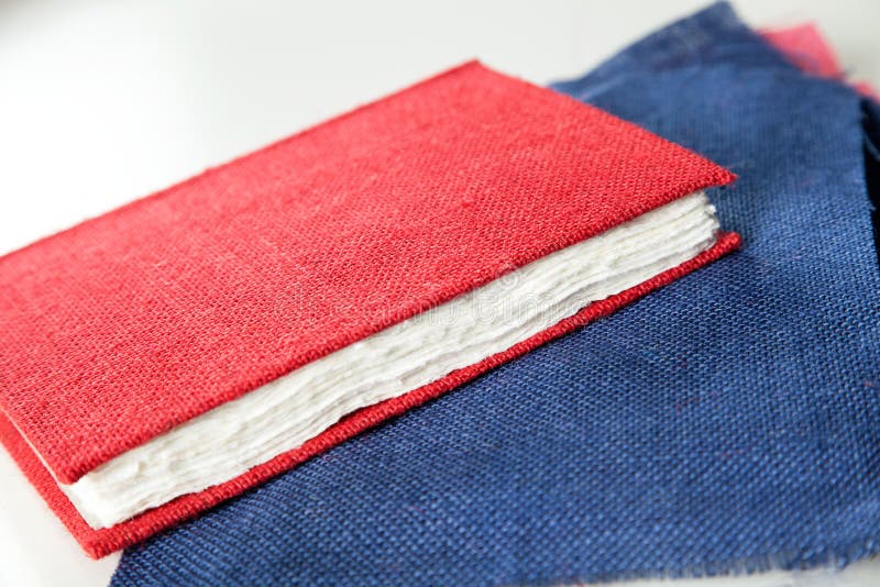 Red Cover Book and Fabric on Table in Factory Stock Photo Image of paper, factories 57935118