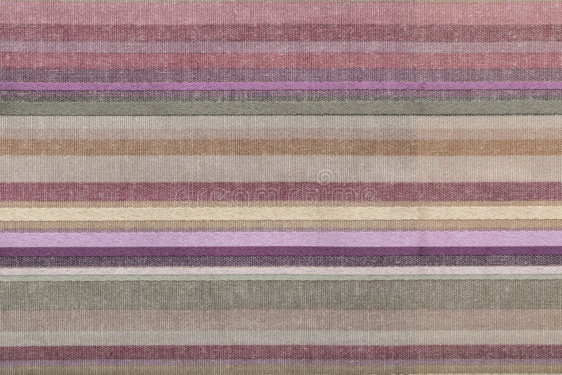 Fabric striped texture. Rustic canvas pattern. Colored striped coarse linen fabric closeup as background