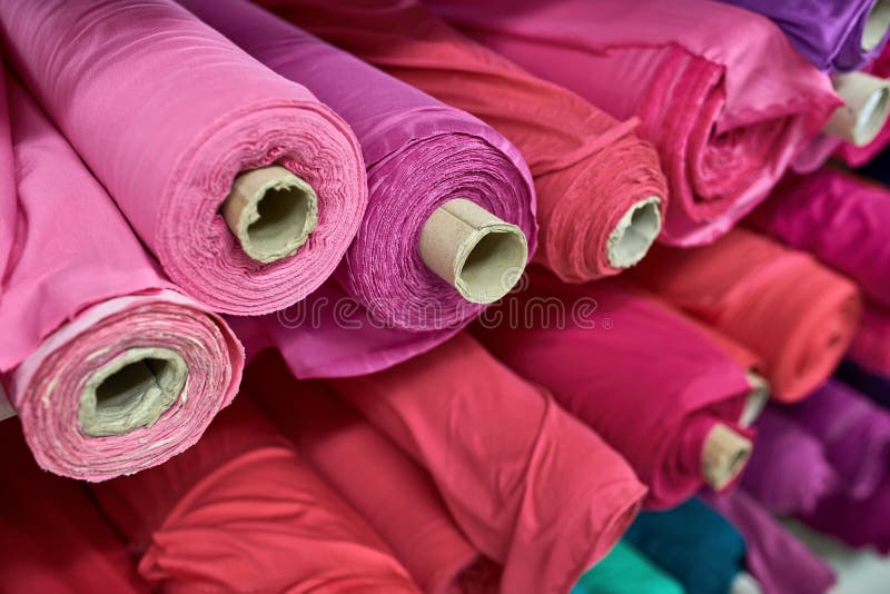 Fabric Warehouse with Many Multicolored Textile Rolls Stock Photo