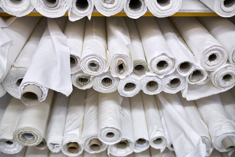 Fabric Warehouse with Many Multicolored Textile Rolls Stock Photo