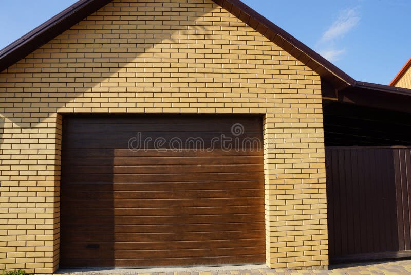 Facade of a Brown Garage with a Closed Gate Stock Image Image of