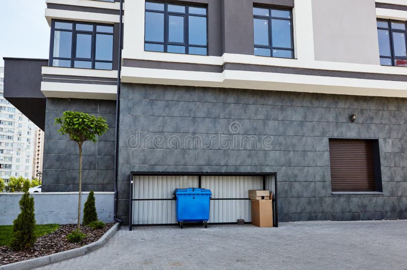 Facade Of A Modern European Apartment Building Blue Container Garbage Facade Of A Modern European Apartment Building Blue Container Garbage
