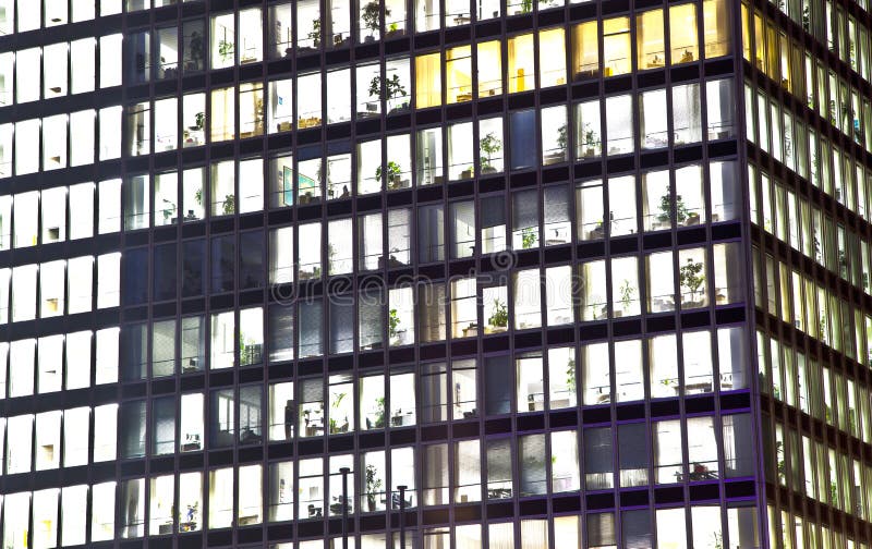 Facade of office building by night