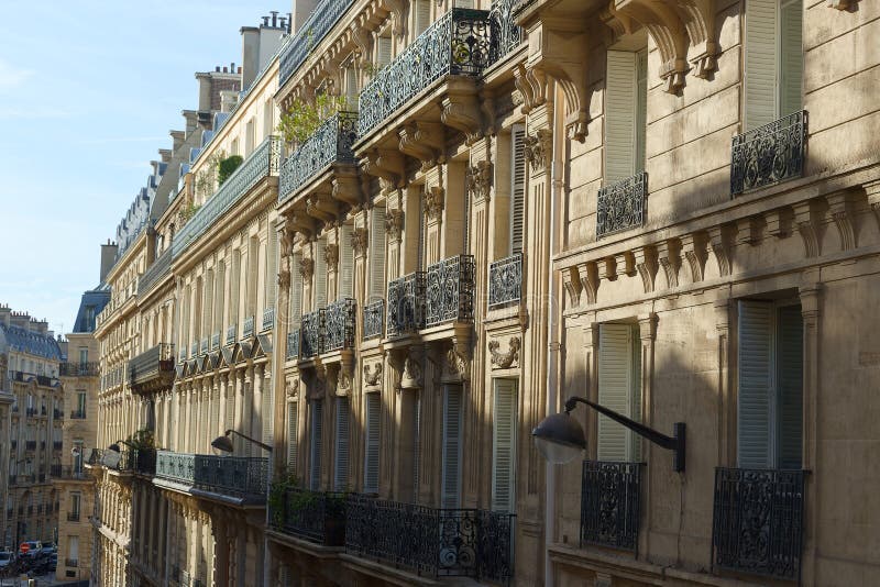 The Facades of Traditional French Houses with Typical Balconies and