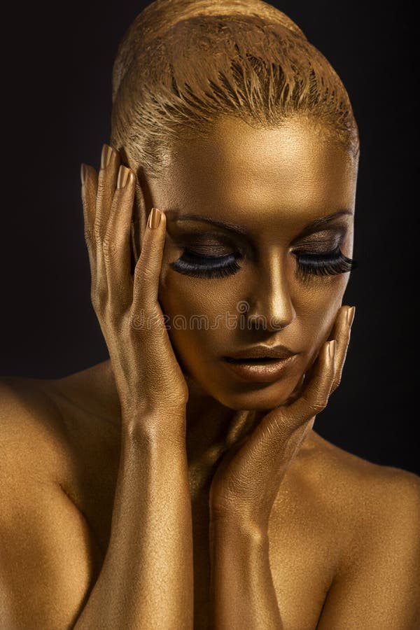 Face Art. Fantastic Gold Make Up. Stylized Colored Woman&x27;s Body