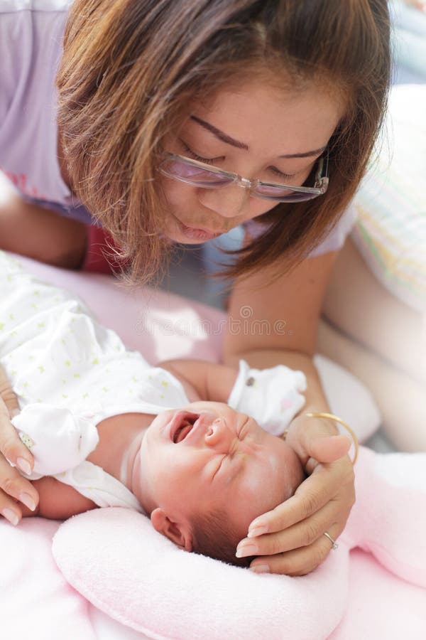 Face of baby infant and mother stock images Face of baby infant and mother stock images