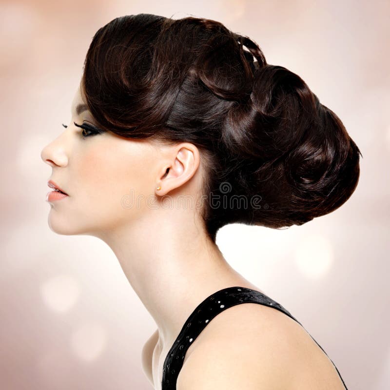 Face of beautiful woman with fashion hairstyle and glamour makeup stock image Face of beautiful woman with fashion hairstyle and glamour makeup stock image
