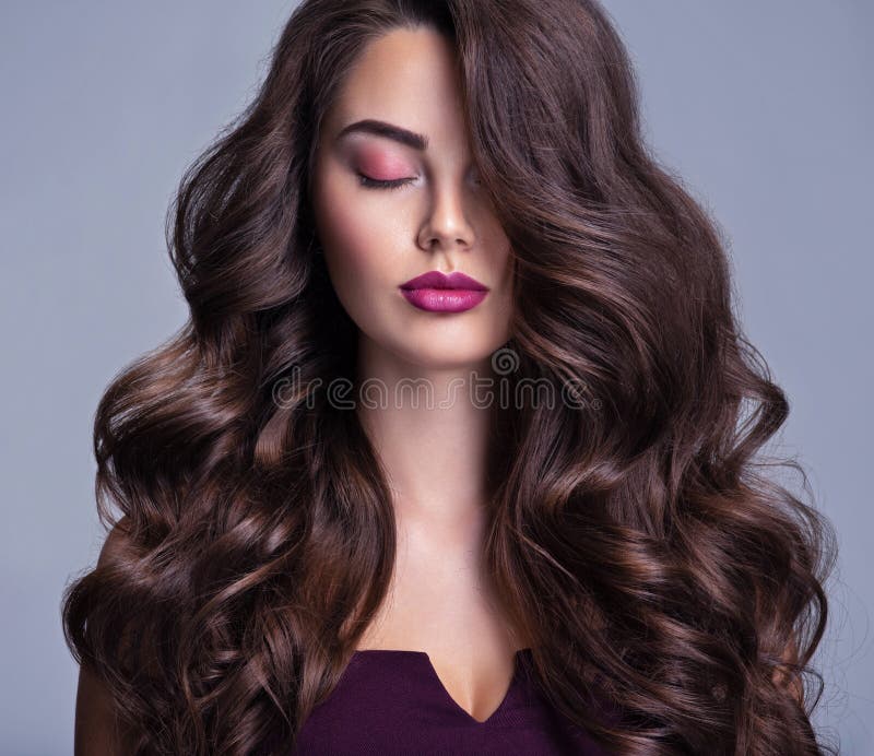 Face Of A Beautiful Woman With Long Brown Curly Hair Fashion Model With Wavy Hairstyle 