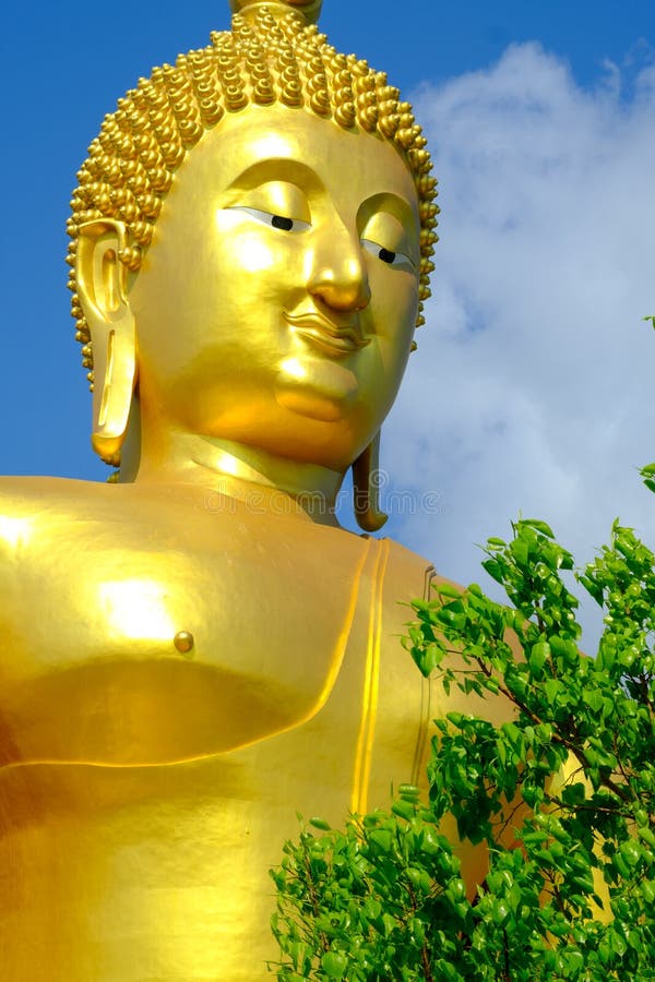 Face of Big golden Buddha with blue sky at Wat muang,Angthong,Thailand royalty free stock images Face of Big golden Buddha with blue sky at Wat muang,Angthong,Thailand royalty free stock images